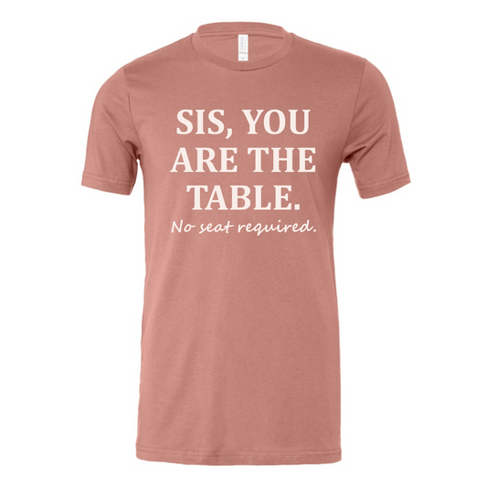 Mauve graphic tee that reads ‘Sis, You Are the Table. No seat required.’ displayed on plain background.